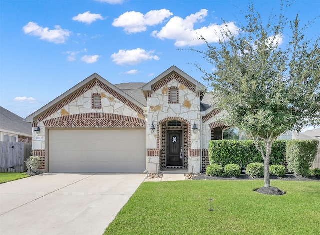 view of front of house featuring a garage and a front lawn