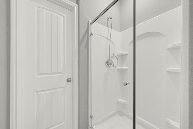 bathroom featuring an enclosed shower