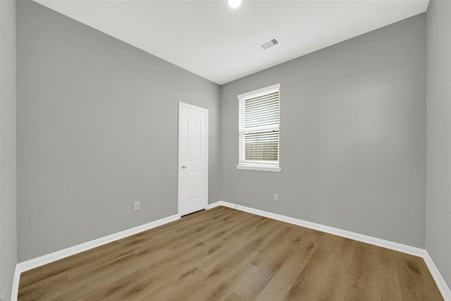 spare room with light hardwood / wood-style floors