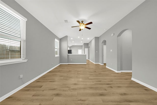 unfurnished living room with light wood-type flooring and ceiling fan