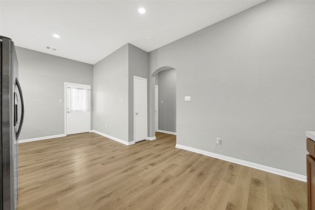 unfurnished living room with light hardwood / wood-style flooring