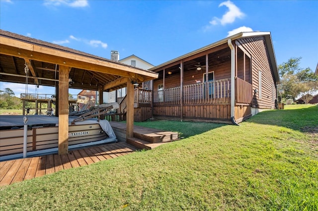 exterior space with a lawn and a wooden deck