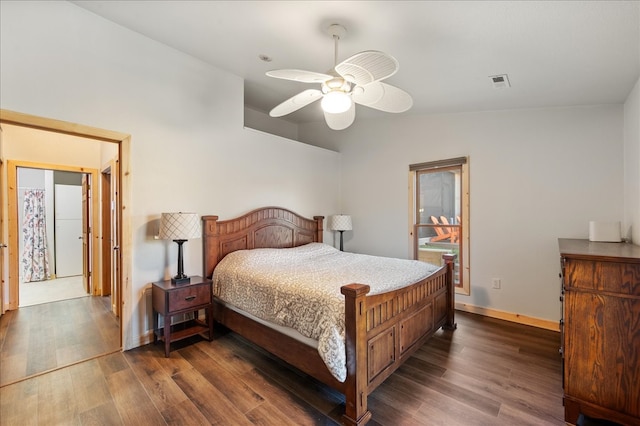 bedroom featuring dark wood-type flooring, ceiling fan, and lofted ceiling