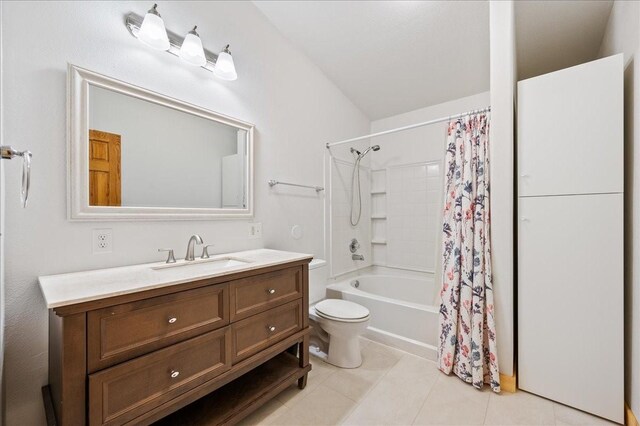 full bathroom featuring vanity, shower / bath combo, vaulted ceiling, tile patterned flooring, and toilet