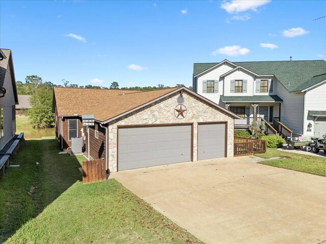 view of front of home featuring a front lawn, a garage, and a porch