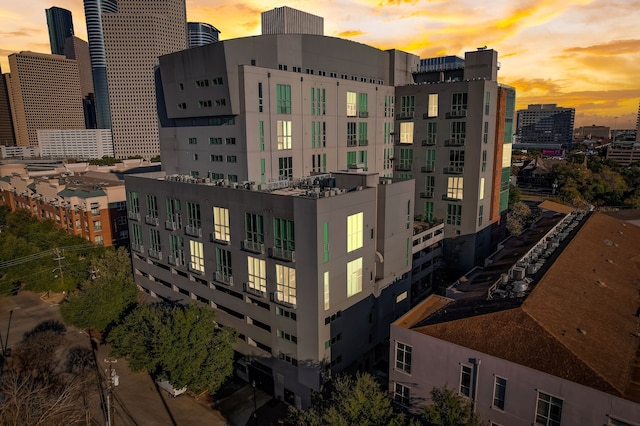 view of outdoor building at dusk