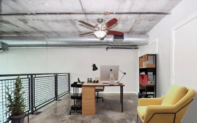 office space with ceiling fan and concrete floors