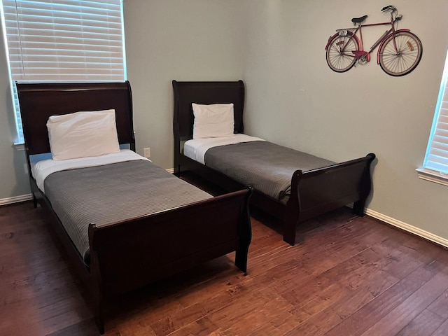 bedroom featuring dark hardwood / wood-style flooring