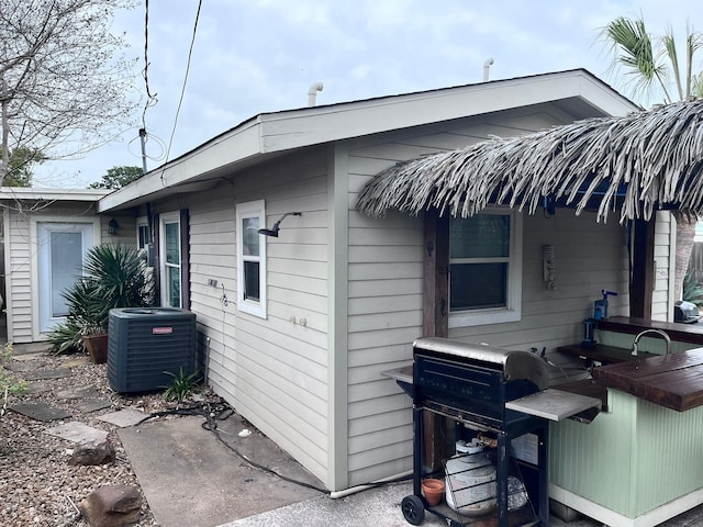 view of side of property with cooling unit