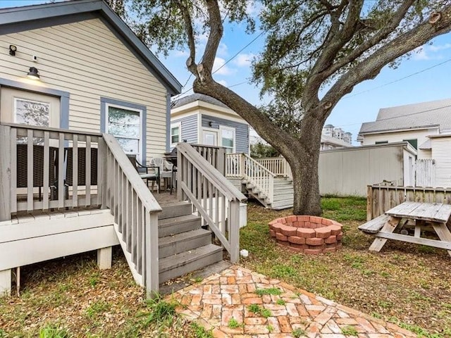 exterior space featuring a fire pit and a deck