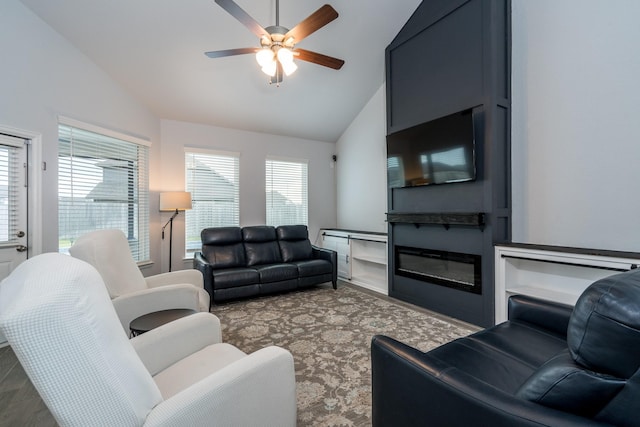 living room with ceiling fan and lofted ceiling