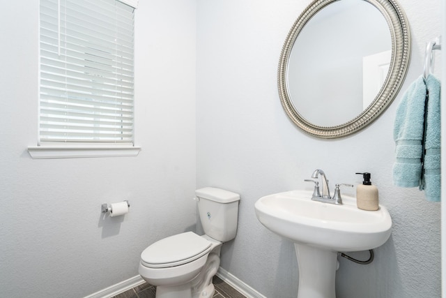 bathroom with sink and toilet