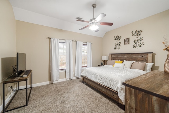 carpeted bedroom featuring ceiling fan and vaulted ceiling