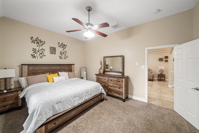 bedroom featuring ceiling fan and light carpet