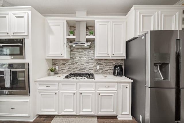 kitchen with white cabinetry, stainless steel appliances, and wall chimney range hood