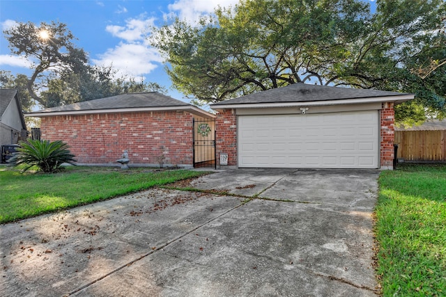 view of front of house with a garage and a front lawn