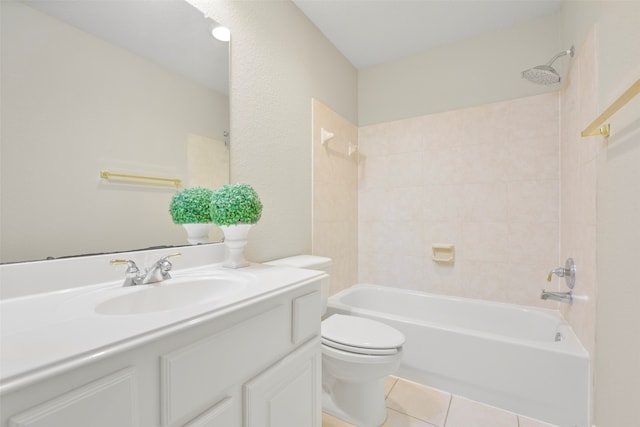 full bathroom featuring vanity, tile patterned floors, toilet, and tiled shower / bath combo