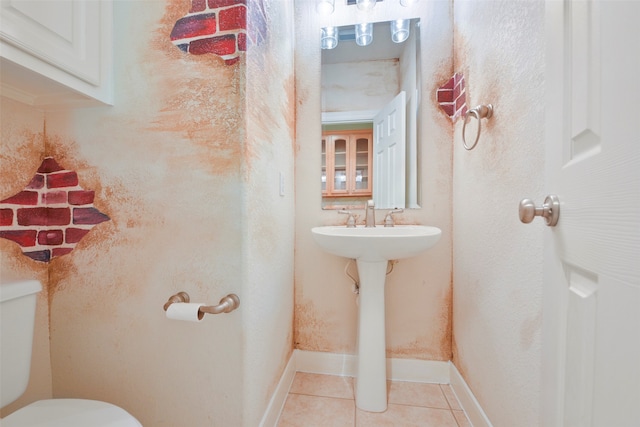 bathroom with tile patterned flooring and toilet