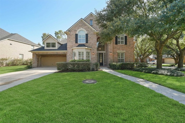 view of front of home featuring a garage and a front lawn