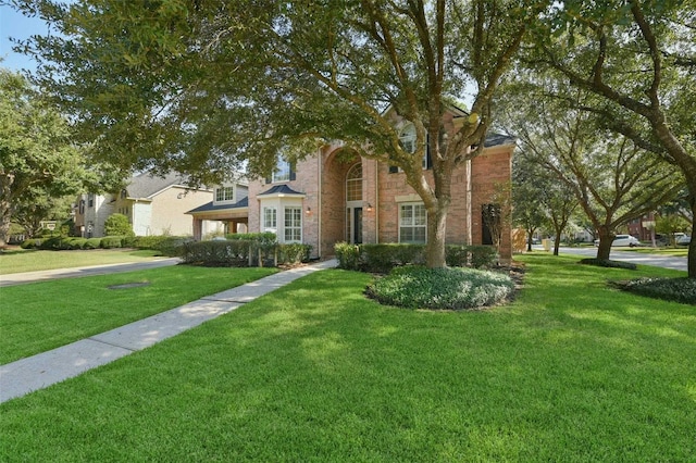 view of front of home with a front lawn