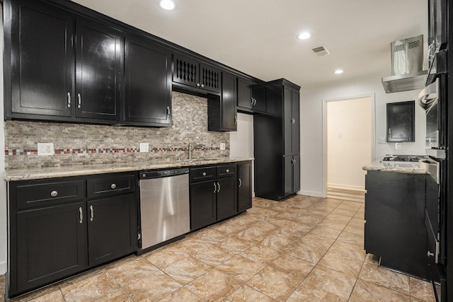 kitchen with dishwasher, light stone counters, sink, and tasteful backsplash