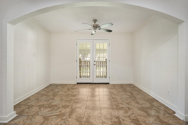 empty room with ceiling fan, crown molding, and french doors