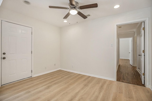 spare room featuring ceiling fan and light wood-type flooring