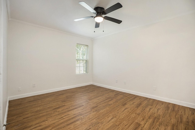 empty room featuring crown molding, ceiling fan, and dark wood-type flooring