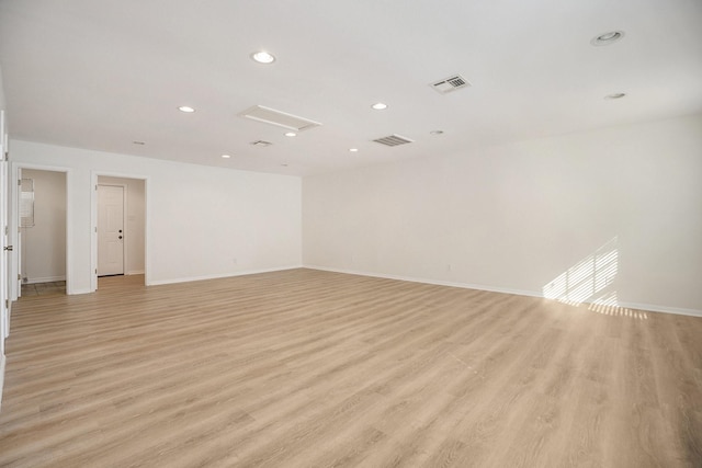 spare room featuring light wood-type flooring