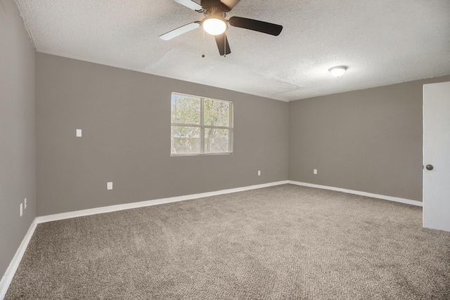 carpeted empty room with ceiling fan and a textured ceiling