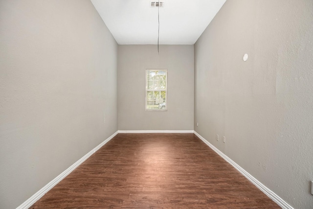 unfurnished dining area featuring dark wood-type flooring