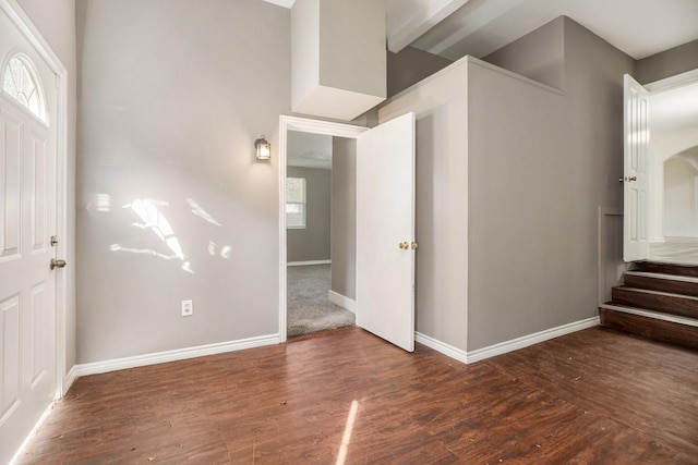 foyer entrance with dark hardwood / wood-style floors