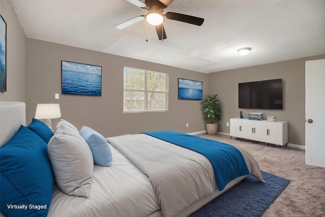 carpeted bedroom featuring ceiling fan