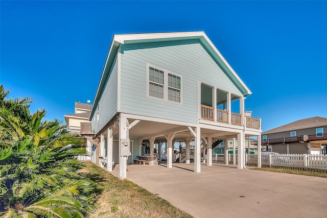 rear view of property with a carport