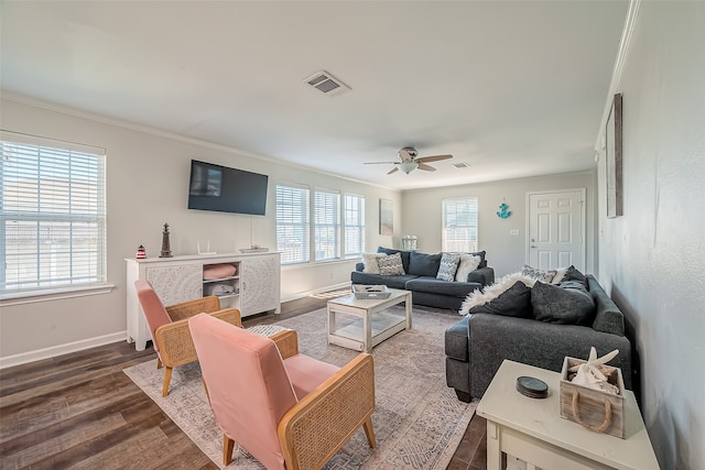 living room with ornamental molding, wood-type flooring, and ceiling fan