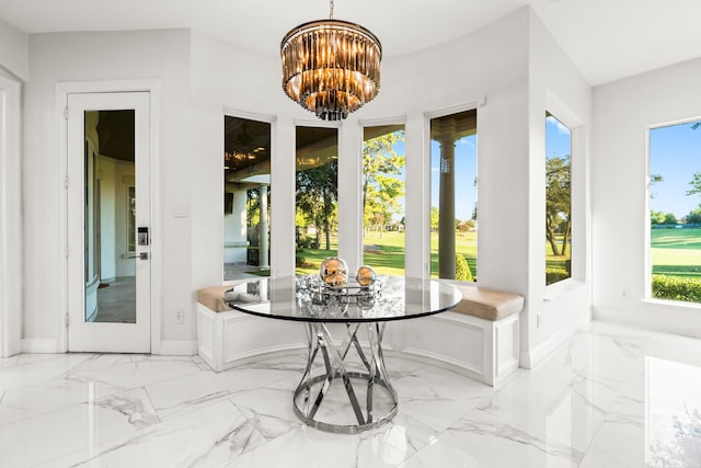 sunroom featuring an inviting chandelier