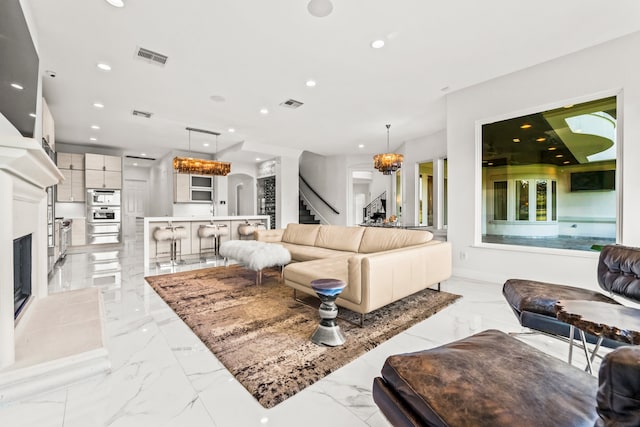 living room with a notable chandelier