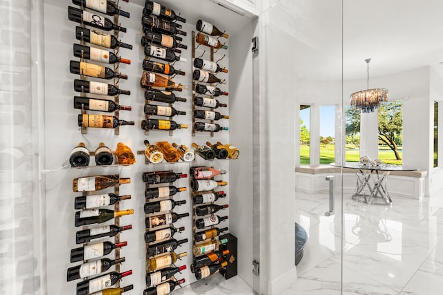 wine cellar featuring a notable chandelier