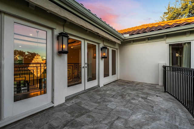 patio terrace at dusk with french doors