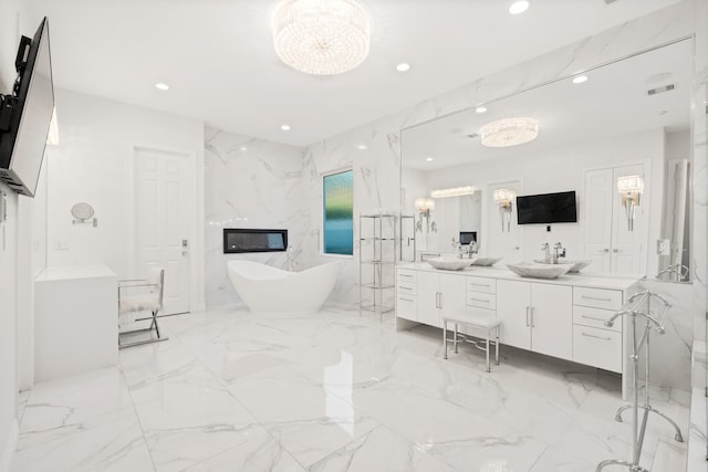 bathroom with vanity and a bath