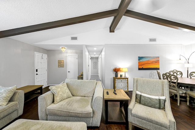 living room featuring a textured ceiling, lofted ceiling with beams, and dark hardwood / wood-style floors