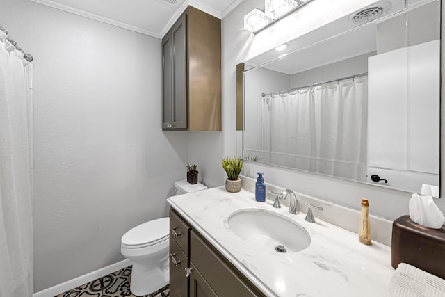 bathroom featuring vanity, toilet, and ornamental molding