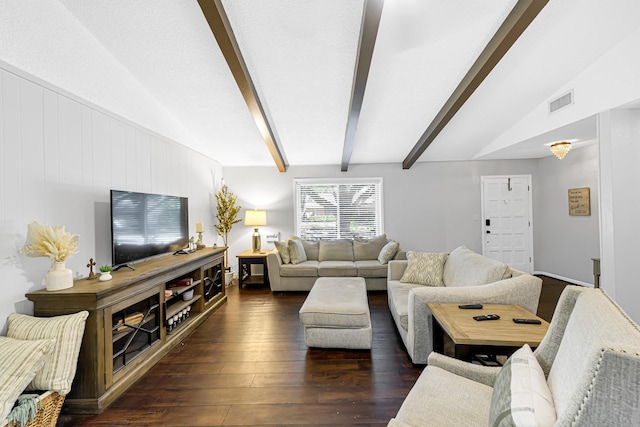 living room featuring vaulted ceiling with beams and dark hardwood / wood-style floors