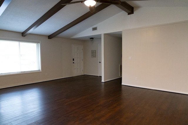 spare room featuring vaulted ceiling with beams, ceiling fan, and dark hardwood / wood-style floors