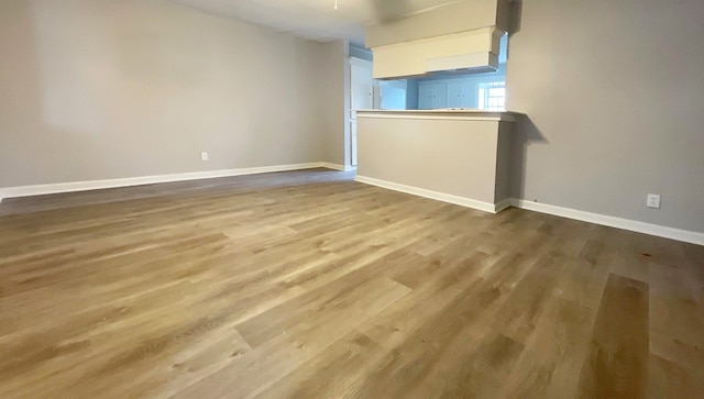 empty room with hardwood / wood-style floors