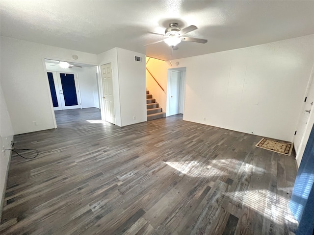 spare room featuring dark wood-type flooring, ceiling fan, a textured ceiling, and french doors