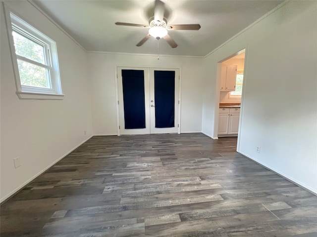 unfurnished room with ornamental molding, french doors, ceiling fan, and dark hardwood / wood-style floors