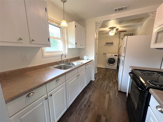 kitchen featuring white cabinets, hanging light fixtures, sink, dark hardwood / wood-style floors, and white appliances