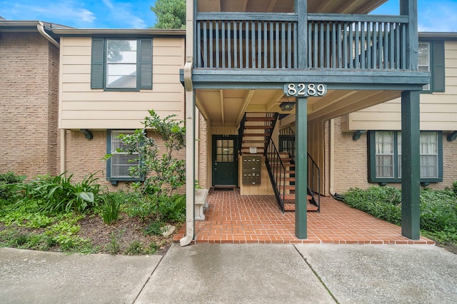 doorway to property featuring a balcony