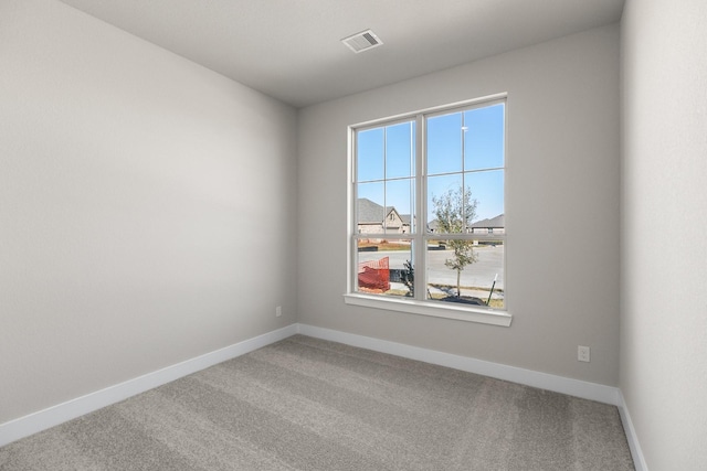 empty room with carpet flooring